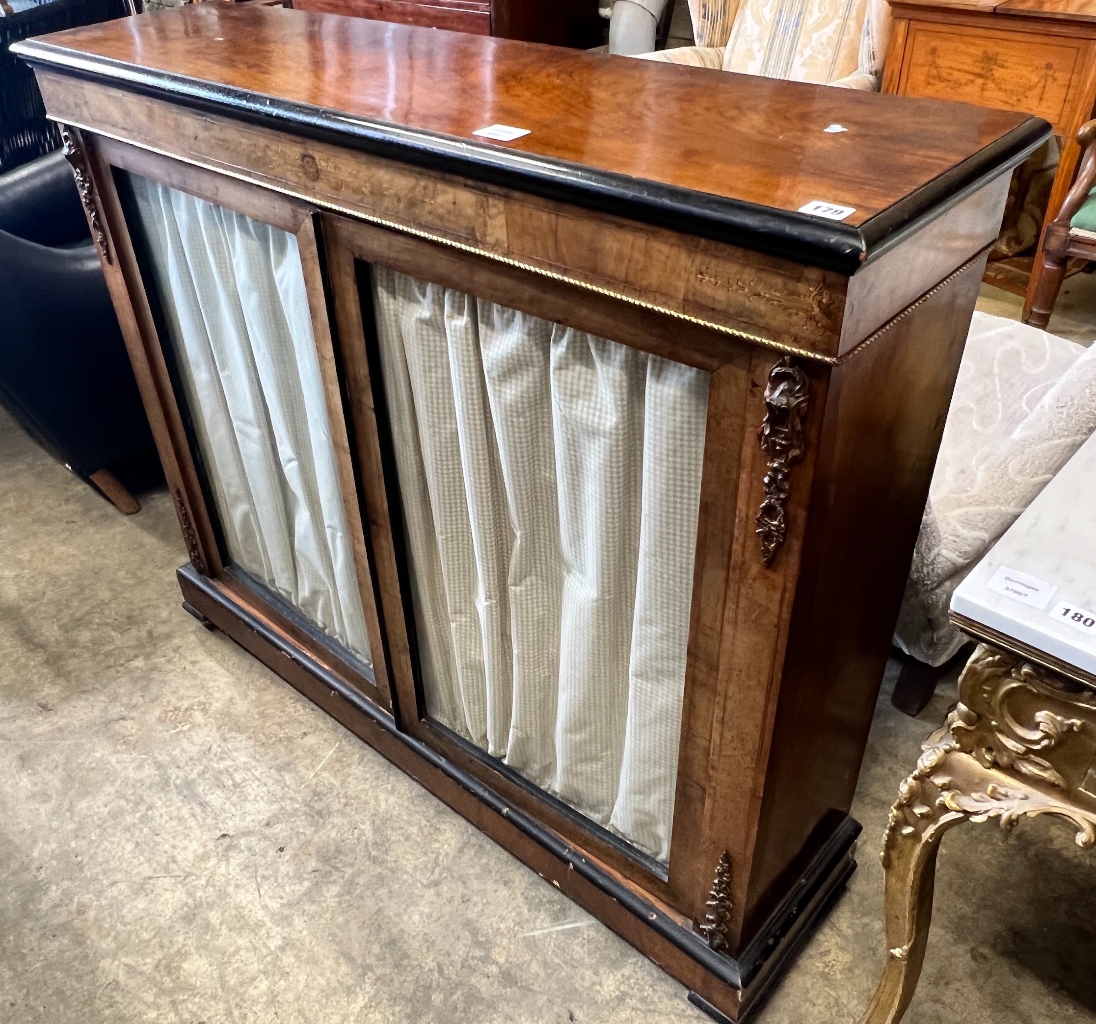 A Victorian gilt metal mounted inlaid walnut two door pier cabinet, width 121cm, depth 32cm, height 105cm